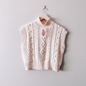cream cableknit sleeveless turtleneck